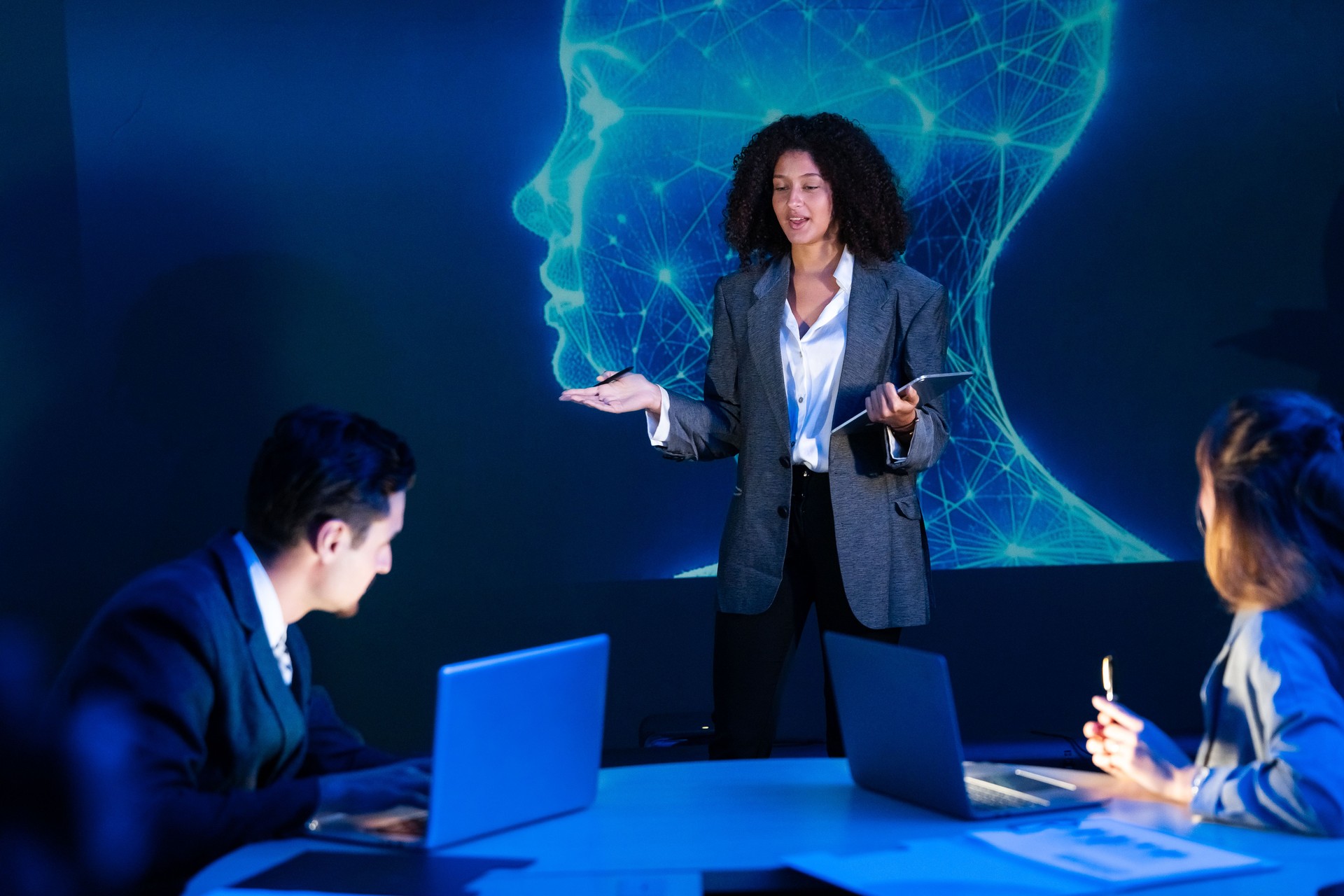 Business professionals in a strategy meeting, discussing technology, artificial intelligence, and global innovation.