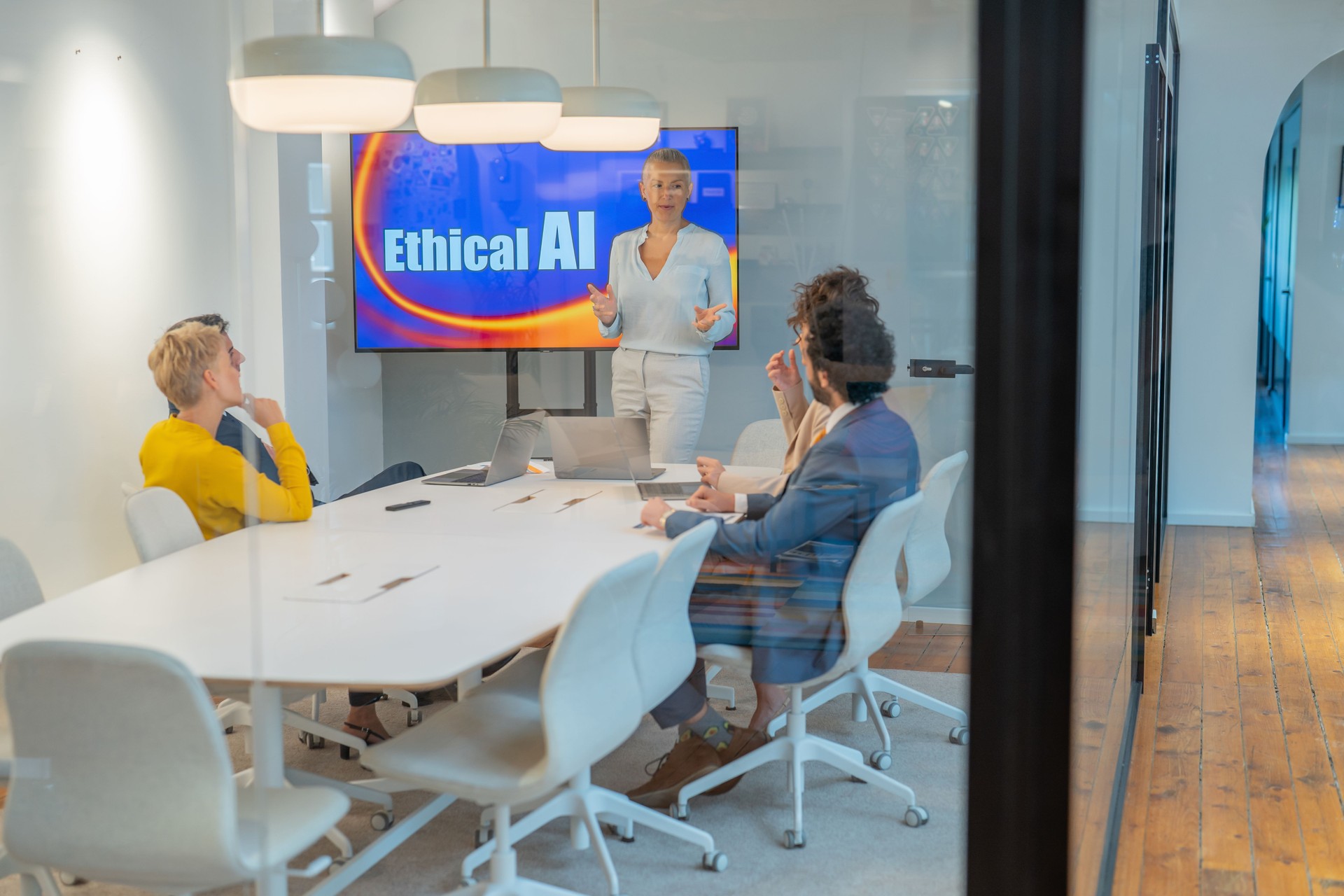 Business team discussing ethical ai during meeting in modern office